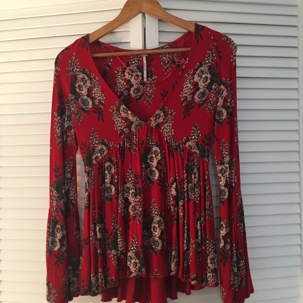 Free People bell sleeve, v neck blouse.